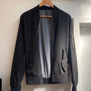 Lightweight black jacket with technical details